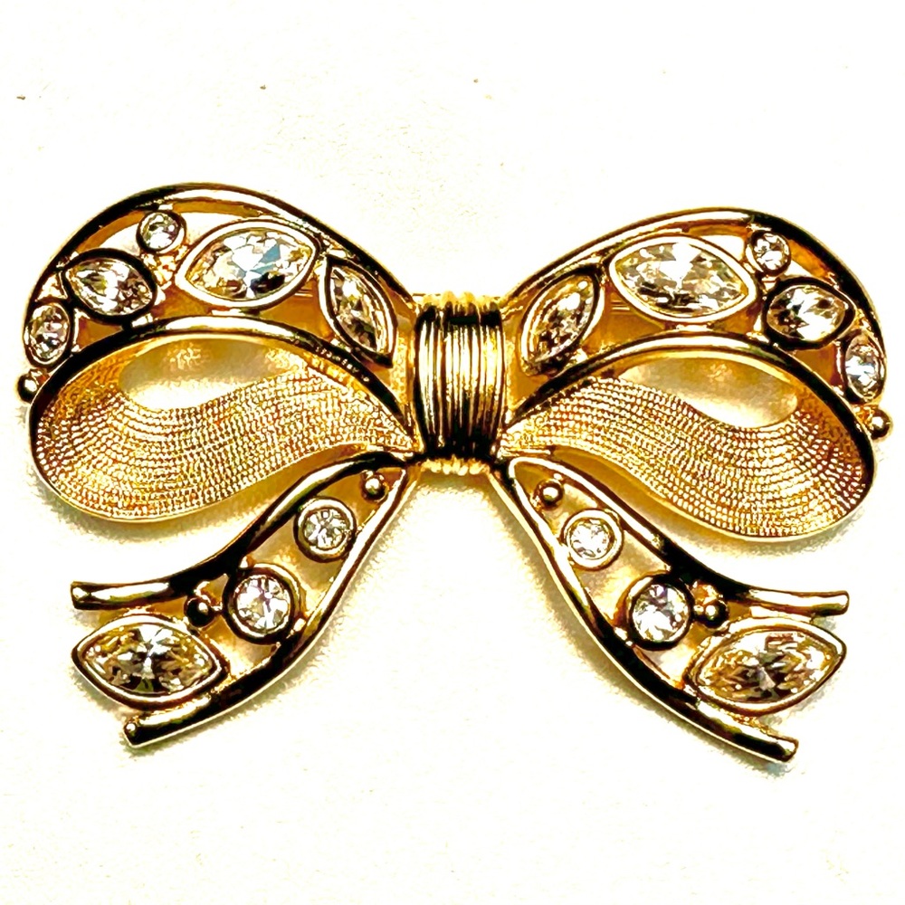 signed Swarovski gold and crystal bow brooch